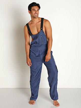 Model in denim blue Nasty Pig Axle Overall Pant