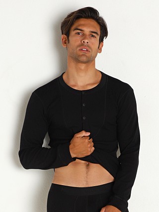 Model in black Modus Vivendi Organic Henley Longsleeve Shirt