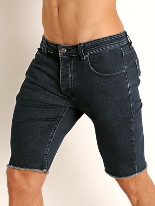 Model in indigo Nasty Pig Cut Off Denim Shorts