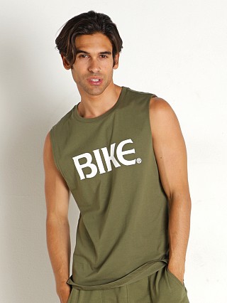 Model in olive Bike Athletic Logo Sleeveless Muscle Shirt