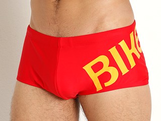 Model in red Bike Athletic High Diver Swim Trunk