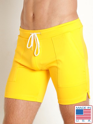 Model in athletic gold LASC 7" Sport Shorts