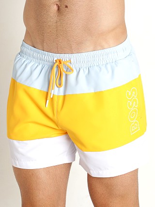 Model in yellow Hugo Boss Coco Swim Shorts