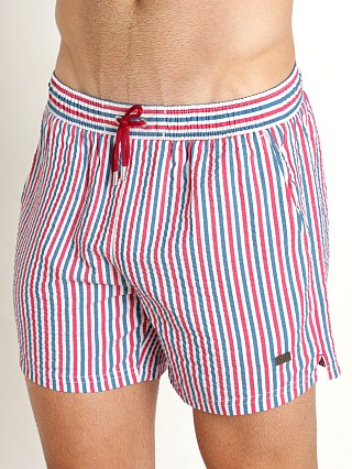 Model in red/white/blue Hugo Boss Velvetfish Swim Shorts