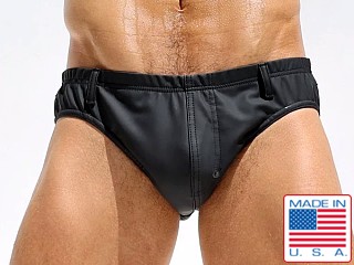 Model in black Rufskin Stud Perfo-Rubber Cheeky Brief