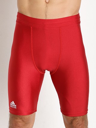 Model in red Adidas Wrestling Compression Short