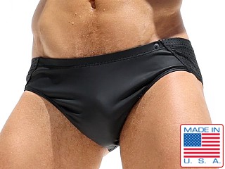 Model in black Rufskin Fire Perfo-Rubber Sunga Brief