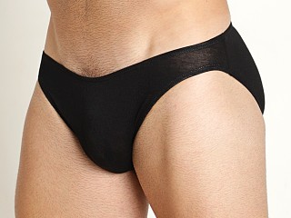 Model in black Mckillop Hustle Sliver Whisper Seamless Front Brief