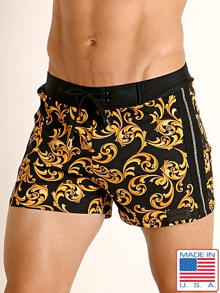 Model in print Sauvage Como Italia Gold Scroll Swim Short