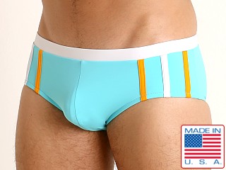 Model in aqua Sauvage Striped Racing Swim Brief