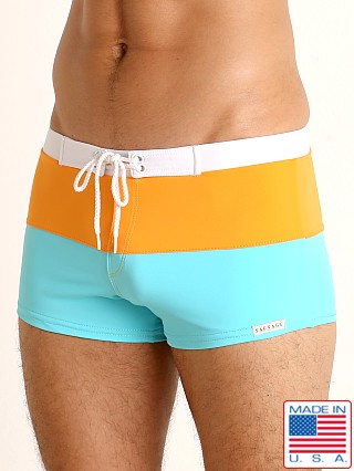 Model in turquoise/orange Sauvage Fitted Square Cut Swim Trunk