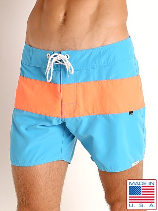 Model in turquoise/orange Sauvage Miami Brights Board Shorts