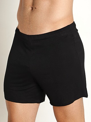 Model in black Mckillop Push Whisper Shorts