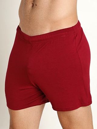 Model in maroon Mckillop Push Whisper Shorts