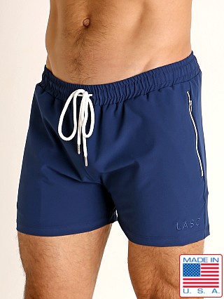 Model in navy LASC Zippered Pockets Stretch Woven Gym Shorts