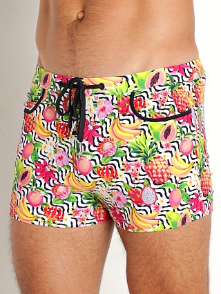 Model in yellow/fuchsia fruits St33le Coast Swim Shorts