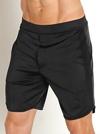 Model in black TOF Paris Gym Long Shorts