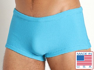 Model in turquoise Rick Majors Ripple Nylon Low Rise Swim Trunk