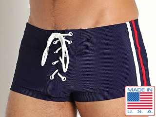 Model in navy Rick Majors Lace-Up Low Rise Swim Trunk