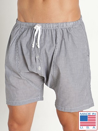 Model in black Rick Majors Sahara Cotton Pinstripe Drop Crotch Shorts