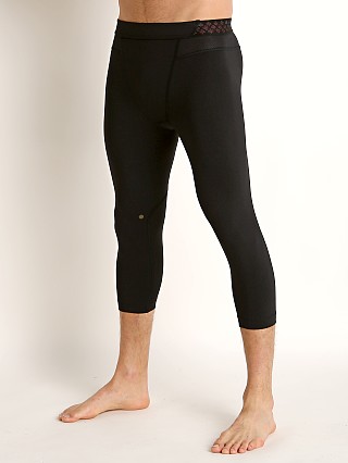 Model in black/black Under Armour Rush 3/4 Legging