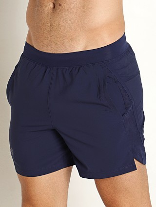 Model in midnight navy/reflective Under Armour Launch 5" Running Short