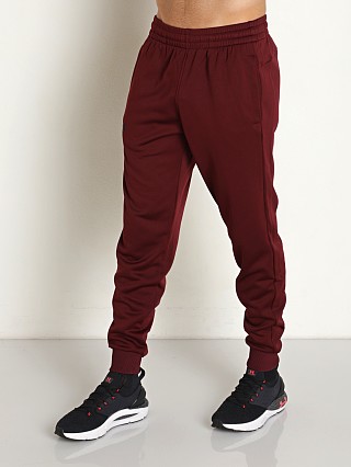 Model in dark maroon Under Armour Fleece Jogger Pants