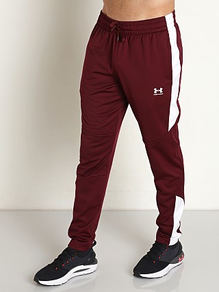 Model in dark maroon Under Armour Tricot Track Pants