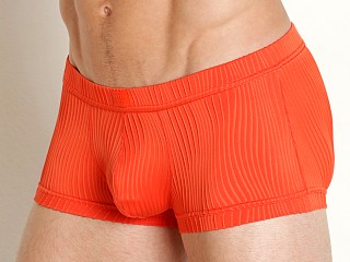 Model in orange Modus Vivendi Curved Line Trunk