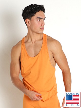 Model in marigold Go Softwear Santa Fe Y-Back Muscle Tank Top