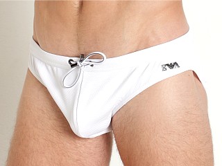 Model in white Emporio Armani Pique Gun Metal Plate Low Swim Brief