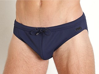 Model in navy Emporio Armani Pique Gun Metal Plate Low Swim Brief