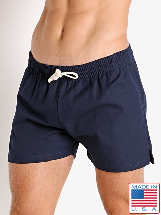 Model in navy LASC Canvas Utility Sling Shorts