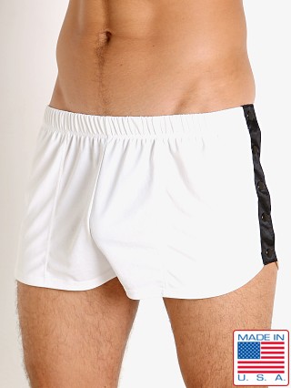 Model in white LASC Matte Jersey Snap Shorts