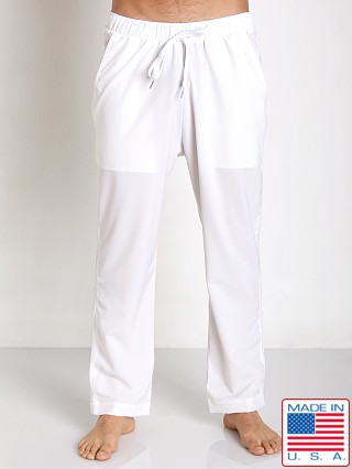 Model in white Sauvage Active Microfiber Mesh Detail Track Pant