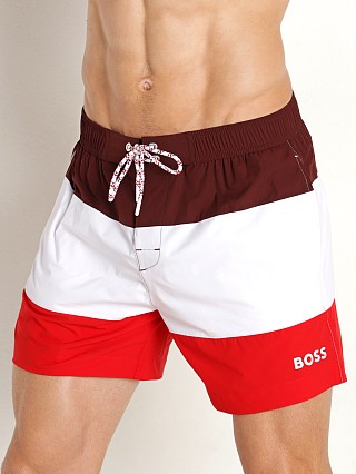 Model in red/white/maroon Hugo Boss Miro Swim Shorts