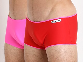 Model in red/fuchsia Modus Vivendi Double Face Reversible Swim Trunk