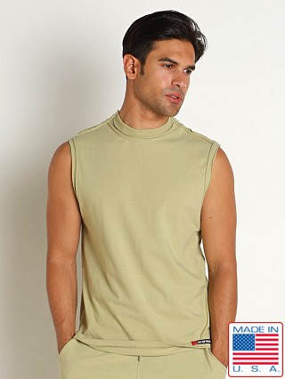 Model in sage leaf Go Softwear Zion OverDye Raw Edge Muscle Shirt