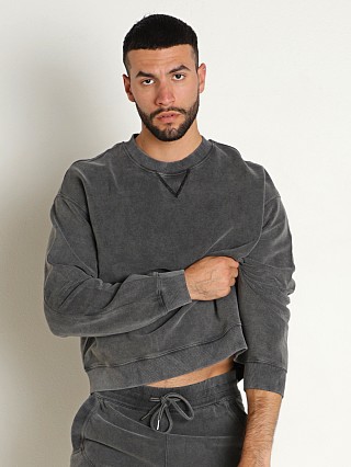 Model in black Nasty Pig Omega Pullover Shirt