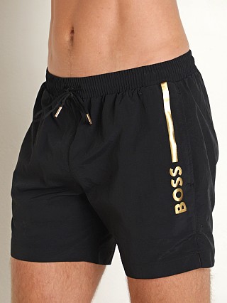 Model in black Hugo Boss OLE Swim Shorts