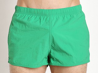 Model in bright green Emporio Armani EA7 Big Logo Swim Shorts