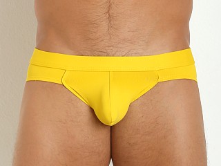 Model in yellow Tulio Power Pouch Supplex Briefs