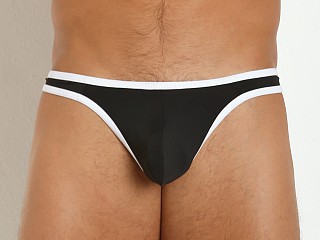 Model in black/white Tulio Sling C-Enhancer Slinky Thong