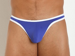 Model in royal/white Tulio Sling C-Enhancer Slinky Thong