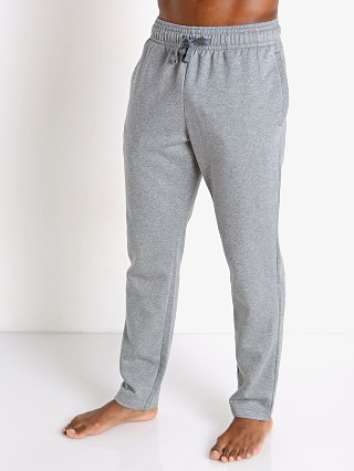 Model in gray light heather Under Armour Rival Fleece Pants