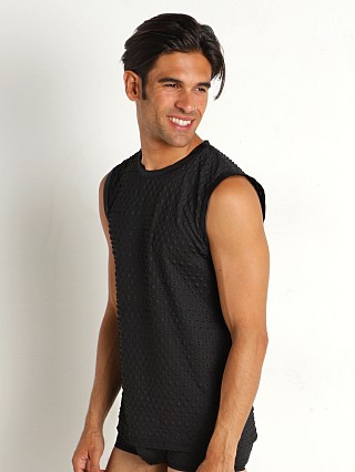 Model in black Modus Vivendi Embossed Dot Sleeveless Muscle Shirt