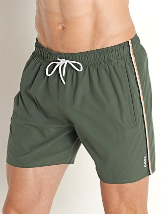 Model in olive Hugo Boss Iconic Swim Shorts