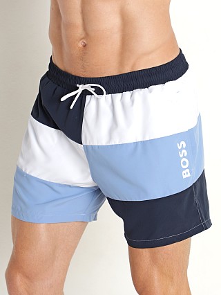 Model in navy/white/turquoise Hugo Boss Court Swim Shorts