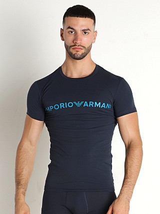 Model in marine Emporio Armani Megalogo Slim Fit T-Shirt