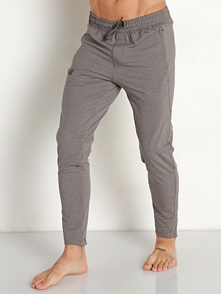 Model in fresh clay Under Armour Meridian Tapered Pants